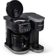 Keurig K-Duo Coffee Maker with single serve and carafe options, adjustable brew strength for personalized coffee.